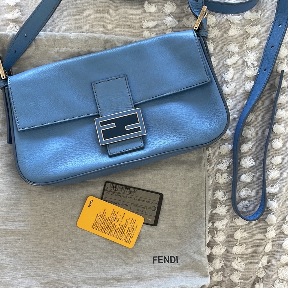 Baby light blue fendi baguette with convertible straps with authenticity card
